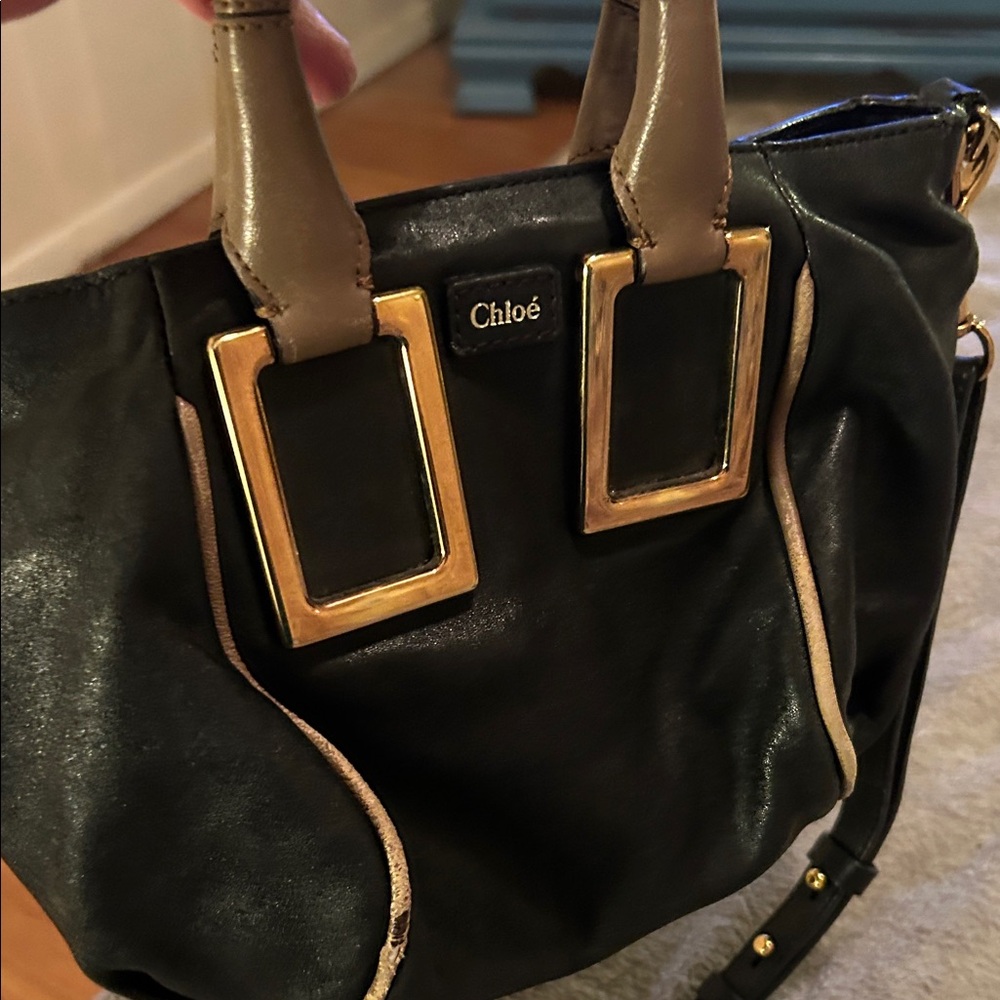 Chloe Black and Gold Shoulder Bag has some exposed piping but otherwise clean